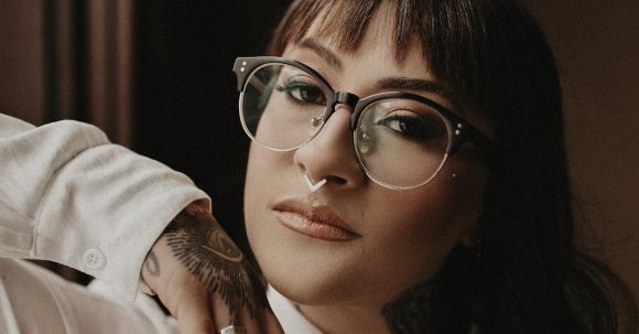 Petite Fashion - Young Woman with Tattoos Wearing a White Shirt and Eyeglasses