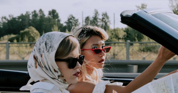 Fashion Guide - Beautiful Women Traveling on a Cabriolet